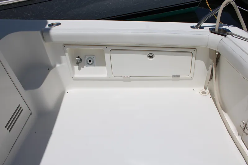 Slide: The Image of 2006 Silverton 42 Convertible boat deck with storage compartment and utility outlet. - 4