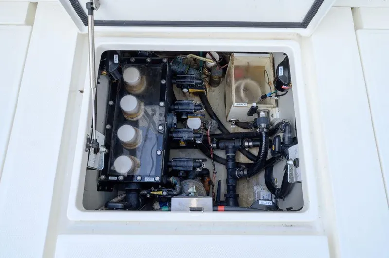 Slide: The Image of Engine compartment of 2021 SeaVee 370z boat, showcasing mechanical components and wiring. - 15