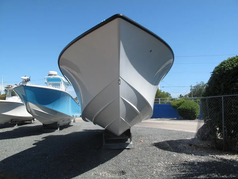 Slide: The Image of 2021 SeaVee 370z boat on land, front view, clear sky background. - 19