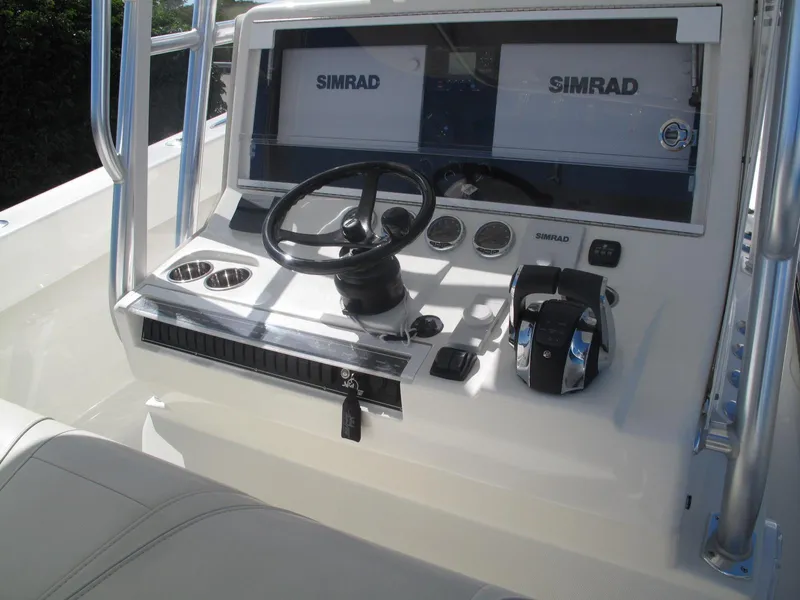Slide: The Image of 2021 SeaVee 370z boat helm with Simrad electronics and dual controls. - 23