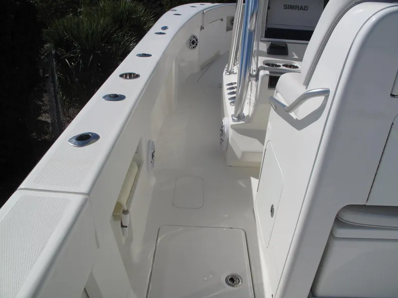 Slide: The Image of 2021 SeaVee 370z boat deck with seating and rod holders. - 24