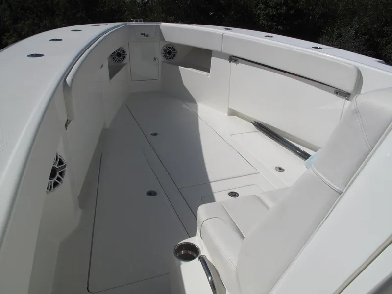 Slide: The Image of 2021 SeaVee 370z boat interior with white seating and spacious deck. - 25