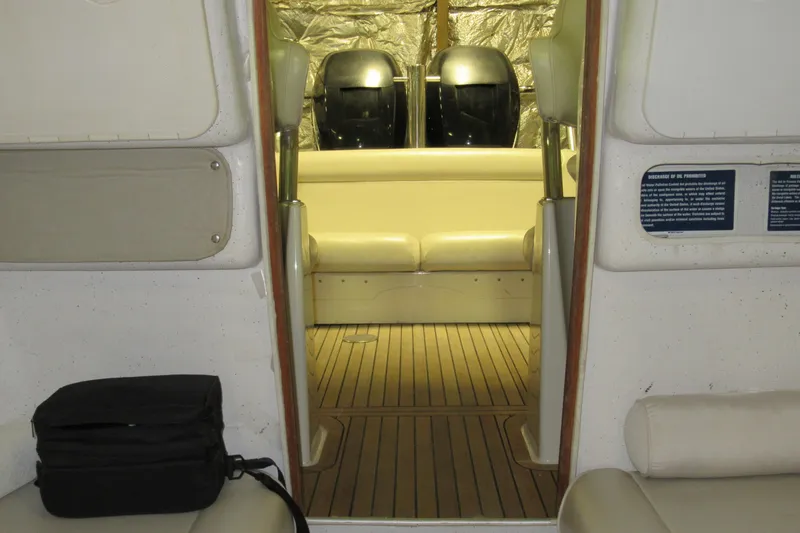 Slide: The Image of Interior view of 2007 Protector Targa 28 boat with seating and wooden flooring. - 5