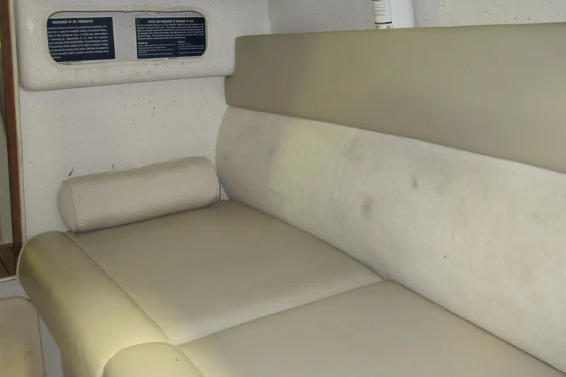 Slide: The Image of Interior cabin of 2007 Protector Targa 28 boat with beige seating. - 8