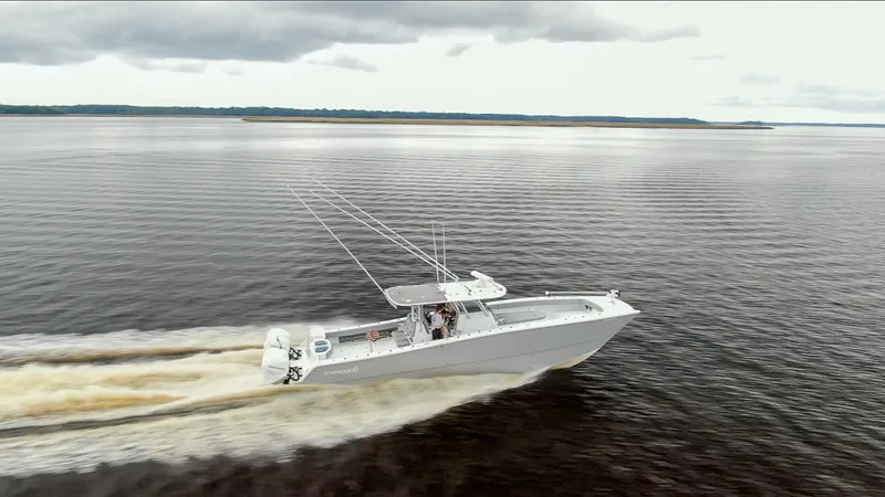 Slide: The Image of Freeman 42LR boat cruising on open water, 2020 model, overcast sky. - 2