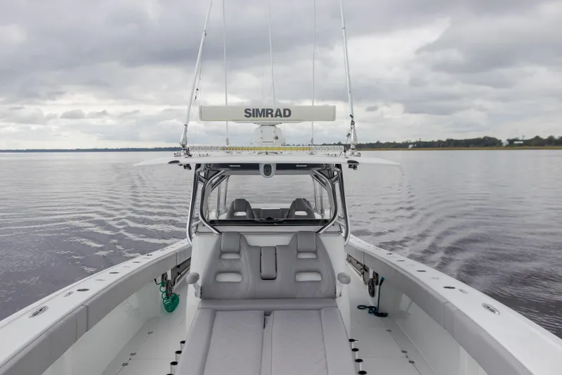 Slide: The Image of Freeman 42LR boat interior, 2020 model, on calm water under cloudy skies. - 6