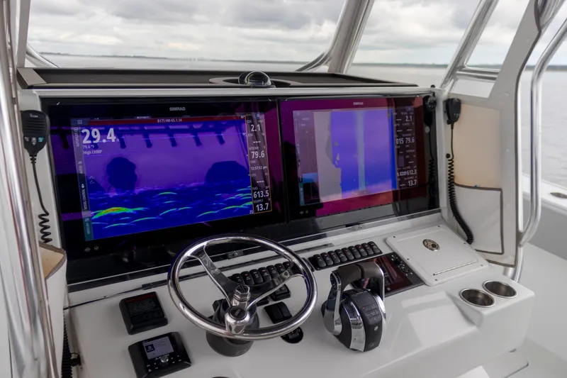 Slide: The Image of Freeman 42LR 2020 boat dashboard with advanced navigation screens and controls. - 7
