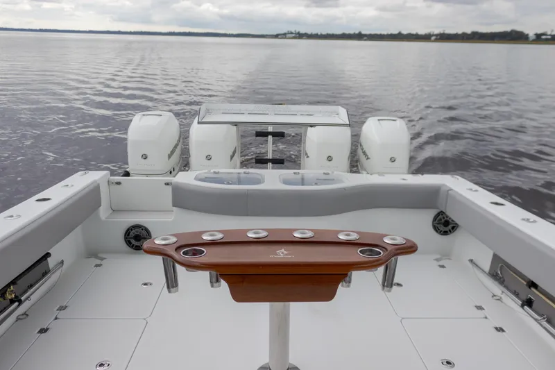 Slide: The Image of Freeman 42LR 2020 boat with dual engines on calm water. - 8