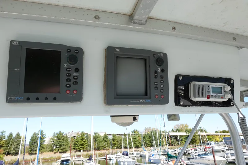 Slide: The Image of Control panel of a 1988 Trojan 10.8 Meter Sedan boat with navigation equipment. - 8