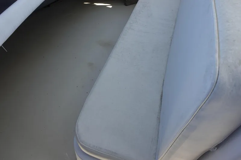 Slide: The Image of 1988 Trojan 10.8 Meter Sedan interior with light gray seating. - 10