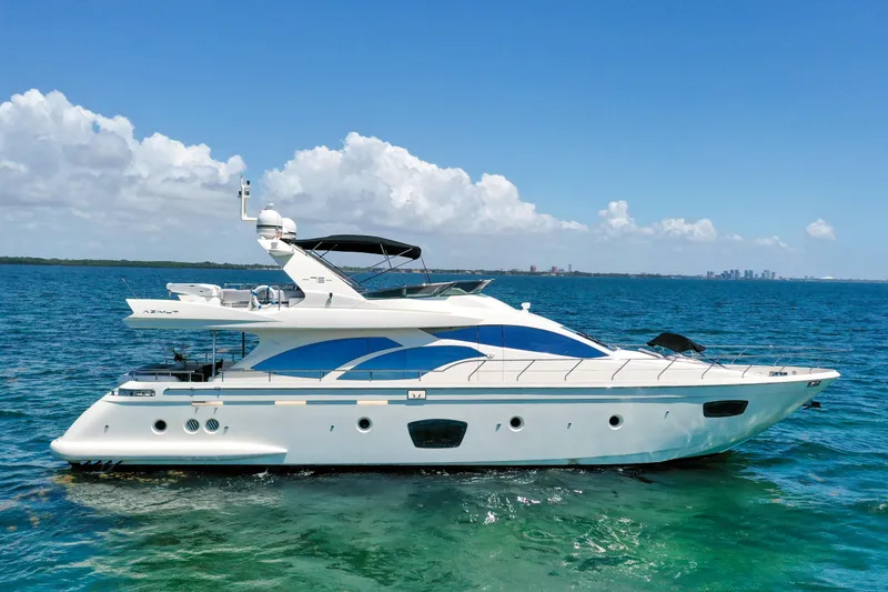Slide: The Image of 2009 Azimut 75 yacht cruising on clear blue ocean waters. - 0