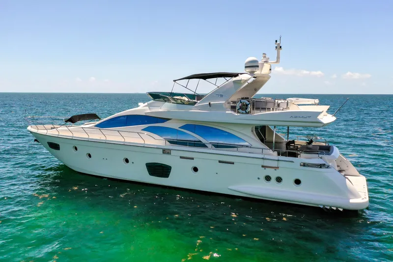 Slide: The Image of Luxury 2009 Azimut 75 yacht cruising on clear blue ocean waters. - 10