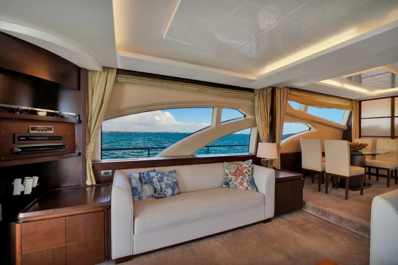 Slide: The Image of Luxurious interior of 2009 Azimut 75 yacht with ocean view, elegant seating, and dining area. - 16