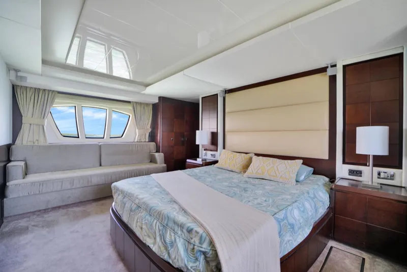 Slide: The Image of Luxurious bedroom interior of 2009 Azimut 75 yacht with large bed and window view. - 30