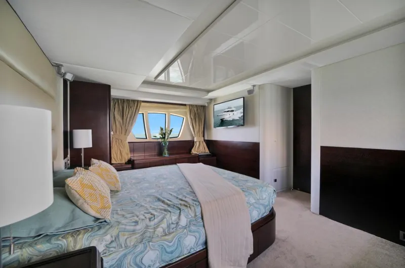 Slide: The Image of Luxurious bedroom interior of 2009 Azimut 75 yacht with elegant decor and large windows. - 31