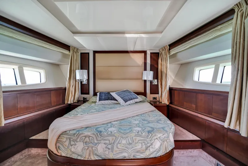 Slide: The Image of Luxurious bedroom interior of 2009 Azimut 75 yacht with elegant bedding and wood accents. - 34
