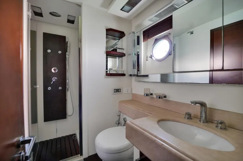 Slide: The Image of Luxurious bathroom in 2009 Azimut 75 yacht with modern fixtures and porthole window. - 35
