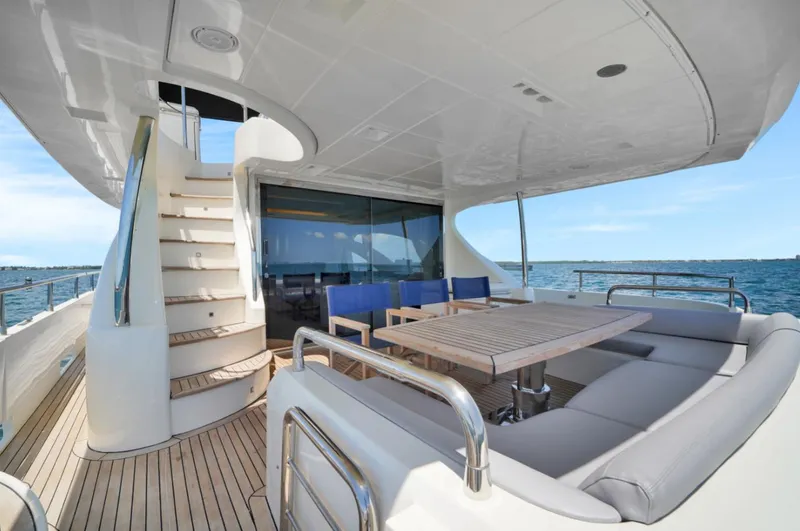 Slide: The Image of Luxurious 2009 Azimut 75 yacht deck with seating, table, and ocean view. - 39