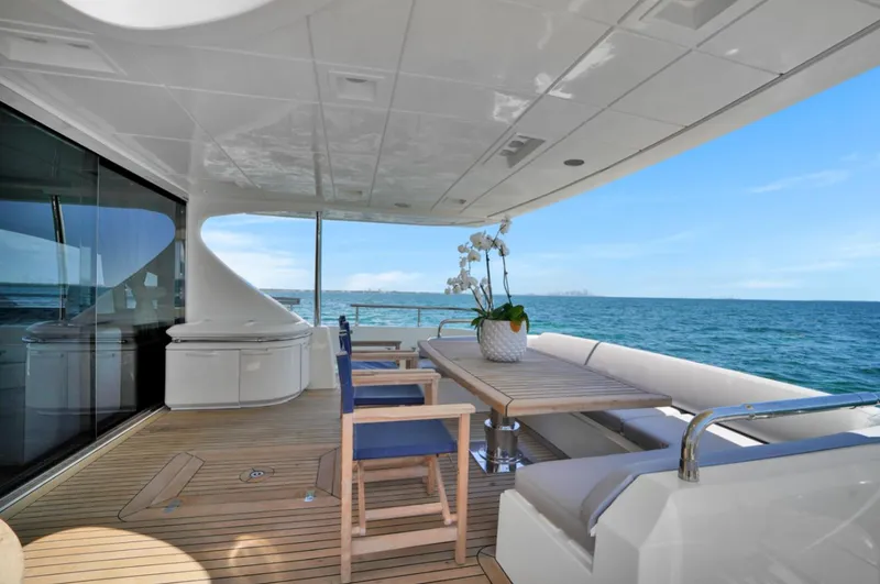Slide: The Image of Luxurious 2009 Azimut 75 yacht deck with seating, table, and ocean view. - 42
