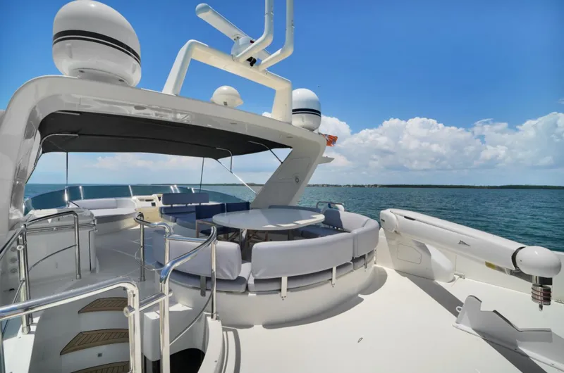 Slide: The Image of Luxurious 2009 Azimut 75 yacht deck with seating, ocean view, and clear blue sky. - 46