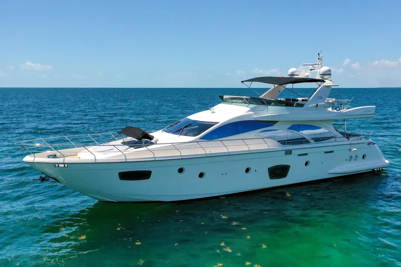 Slide: The Image of Luxurious 2009 Azimut 75 yacht cruising on clear blue ocean waters. - 5