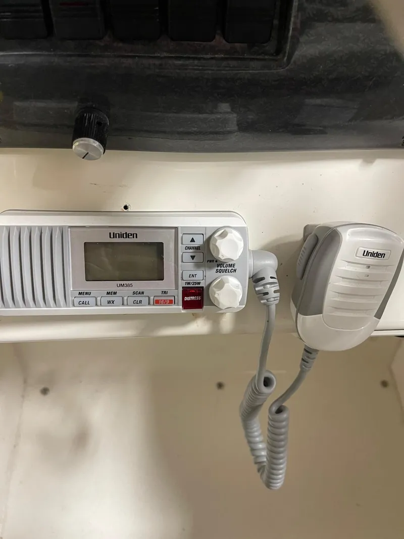 Slide: The Image of Uniden marine radio in 1999 Larson 330 CABRIO boat cockpit. - 18