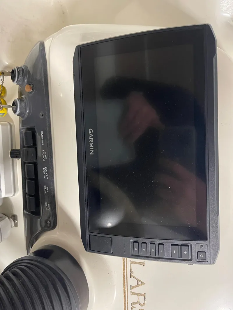 Slide: The Image of Garmin navigation system on 1999 Larson 330 Cabrio boat dashboard. - 20