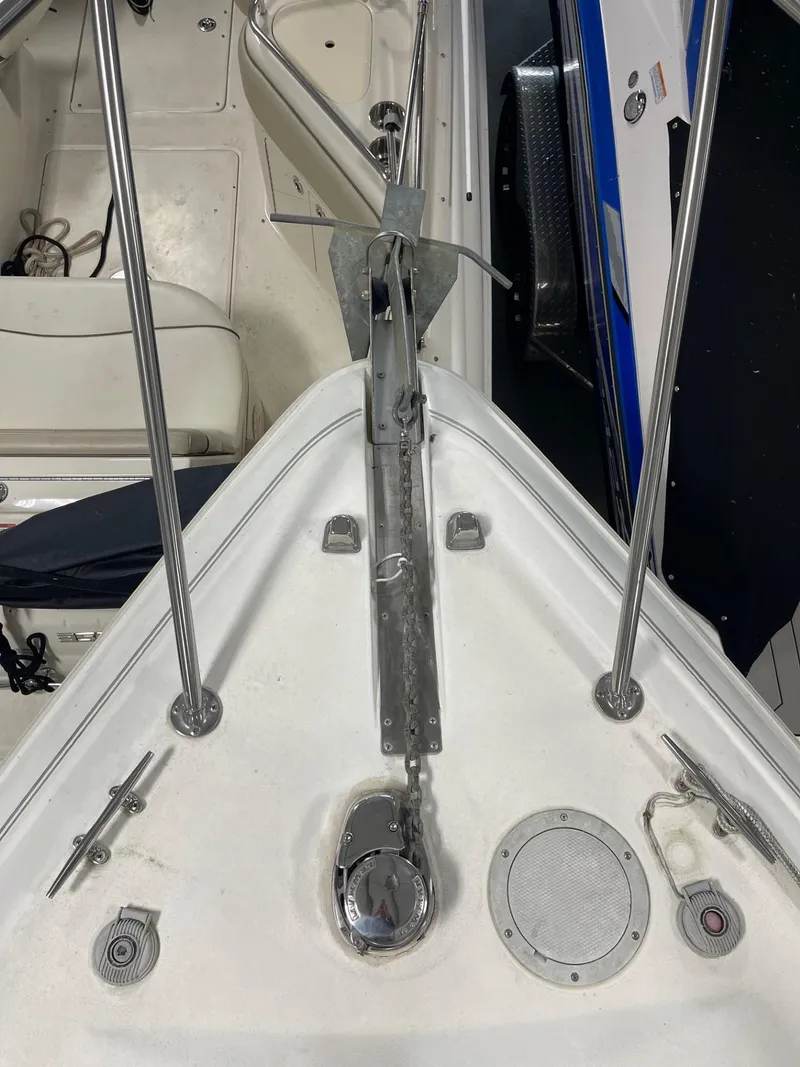 Slide: The Image of 1999 Larson 330 CABRIO boat deck with anchor and cleats. - 36