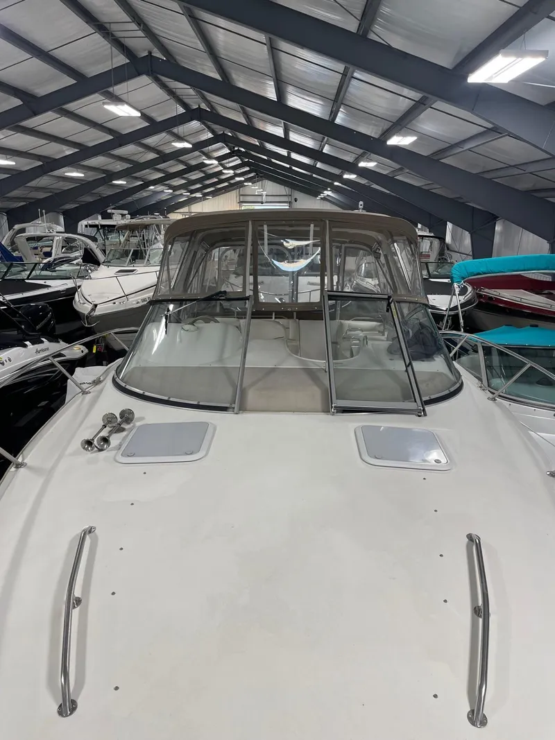 Slide: The Image of 1999 Larson 330 CABRIO boat in indoor storage facility. - 37