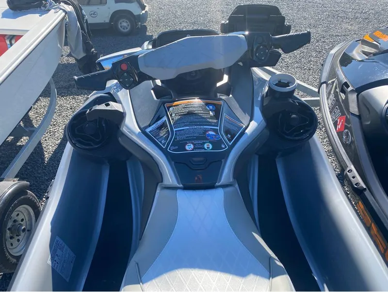 Slide: The Image of 2022 Sea-Doo GTX 300 jet ski with iBR and audio system, parked on gravel. - 4