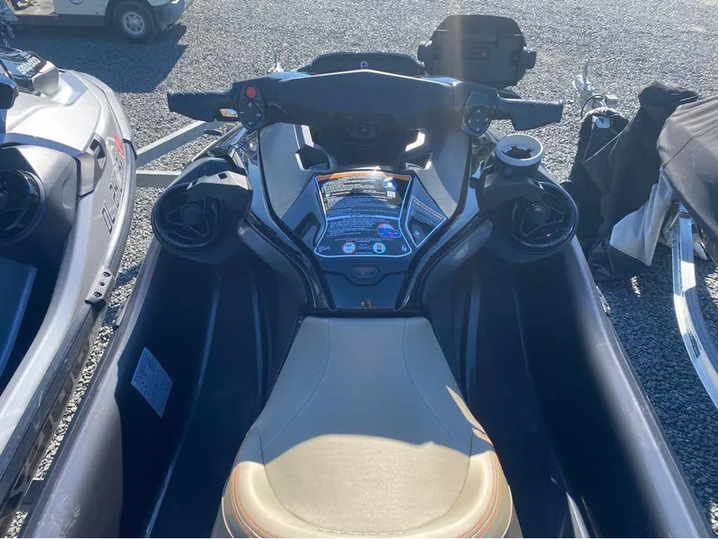 Slide: The Image of 2022 Sea-Doo GTX 300 with iBR and audio system, parked on gravel. - 8