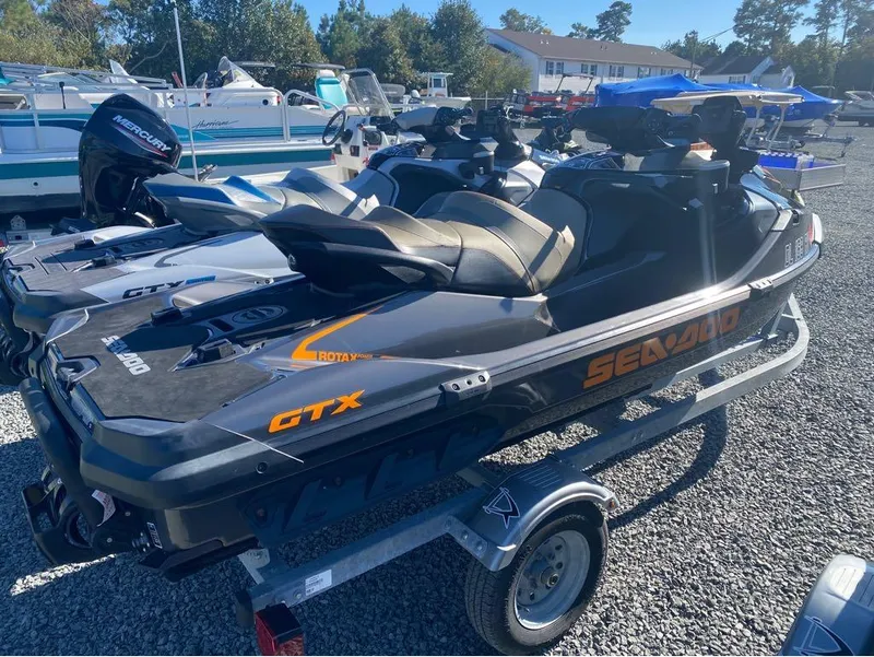 Slide: The Image of Pair of 2022 Sea-Doo GTX 300 jet skis with iBR and audio on a trailer. - 9
