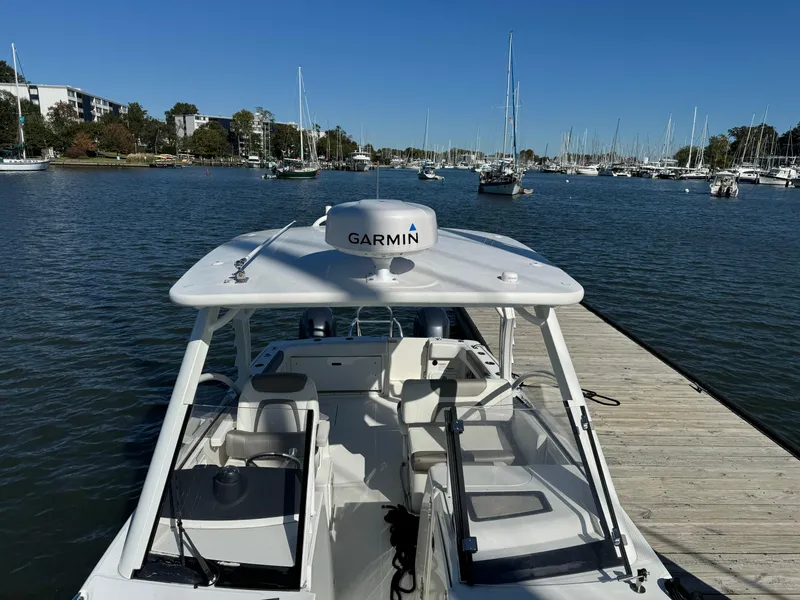 Slide: The Image of 2020 World Cat 280 DC x boat docked in a marina with Garmin equipment. - 15