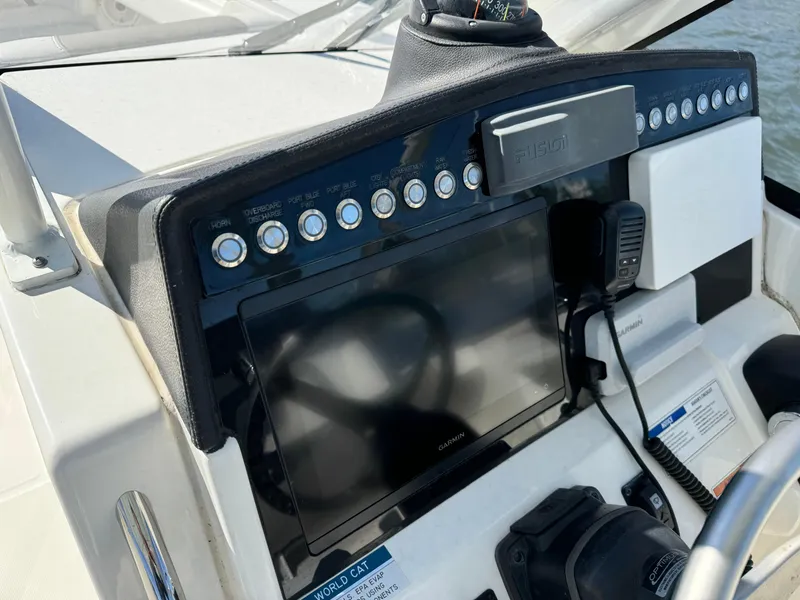 Slide: The Image of Control panel of 2020 World Cat 280 DC x boat with Garmin display. - 19