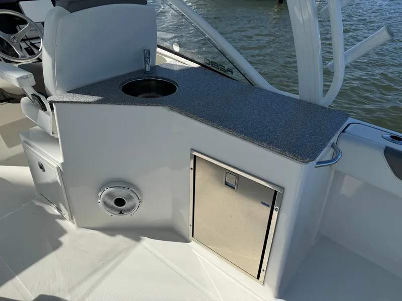 Slide: The Image of 2020 World Cat 280 DC x boat interior with sink and storage. - 21