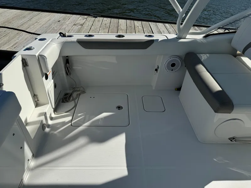 Slide: The Image of 2020 World Cat 280 DC x boat interior with seating and storage compartments. - 23