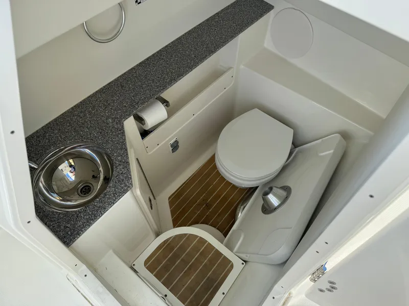 Slide: The Image of 2020 World Cat 280 DC x boat bathroom with sink and toilet. - 25