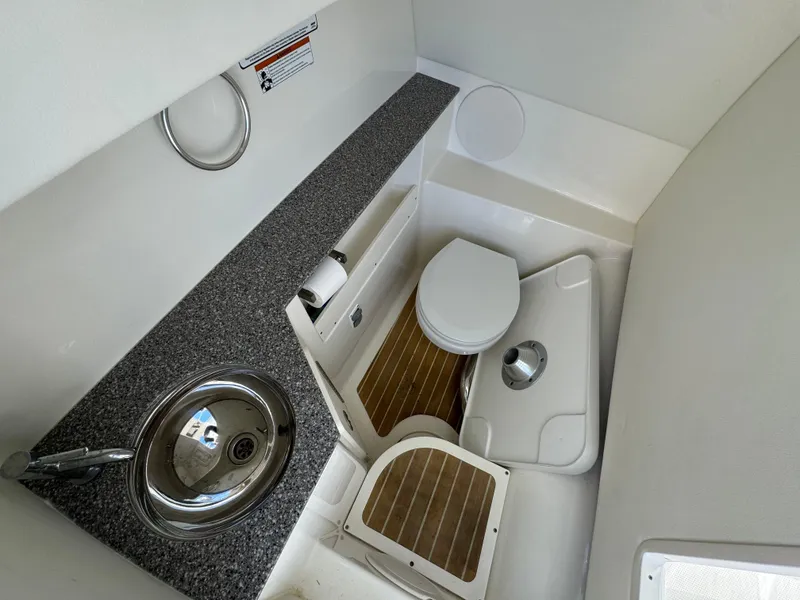 Slide: The Image of 2020 World Cat 280 DC x boat bathroom with sink and toilet. - 26
