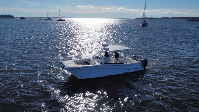 Slide: The Image of 2020 World Cat 280 DC x boat cruising on a sunny, open sea. - 28