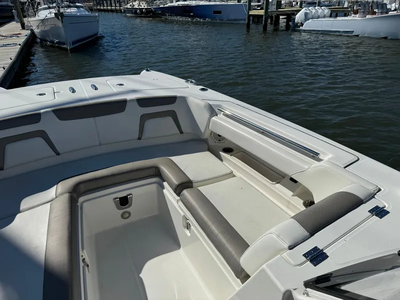 Slide: The Image of 2020 World Cat 280 DC x boat interior with spacious seating at dock. - 8