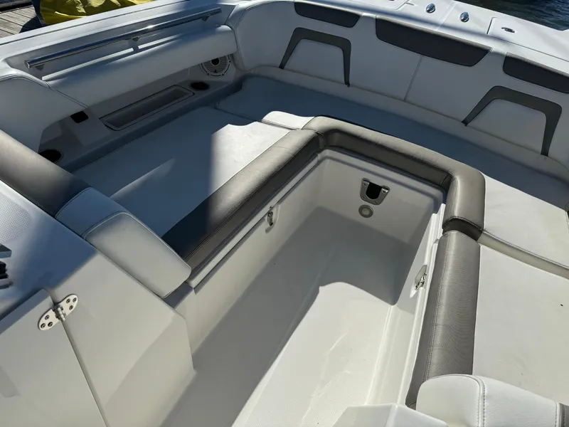 Slide: The Image of 2020 World Cat 280 DC x boat interior with spacious seating and storage. - 9