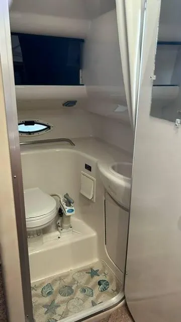 Slide: The Image of 2002 Bayliner 2655 Ciera boat bathroom with toilet and sink. - 11