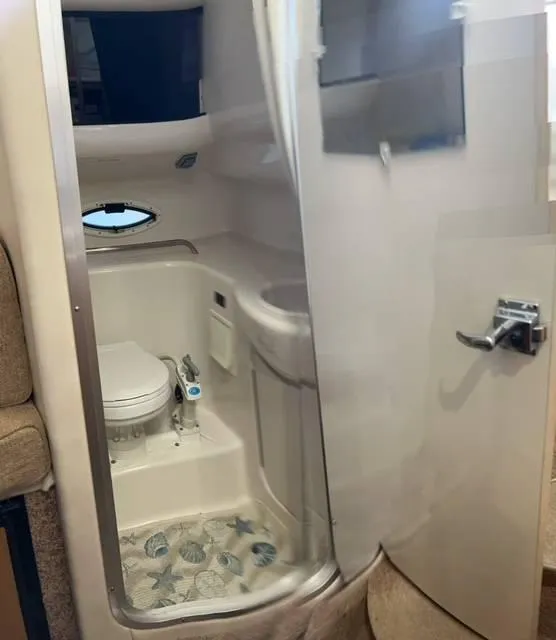 Slide: The Image of 2002 Bayliner 2655 Ciera boat bathroom with toilet and sink. - 13
