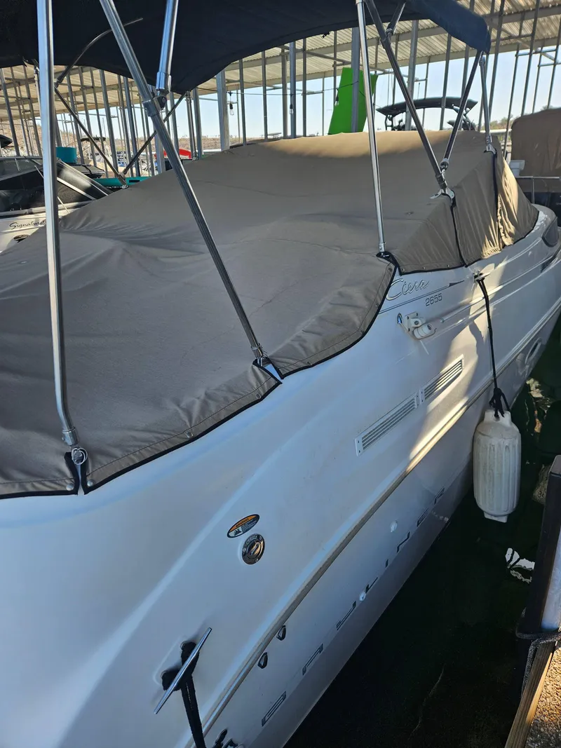 Slide: The Image of 2002 Bayliner 2655 Ciera boat with cover in marina. - 3