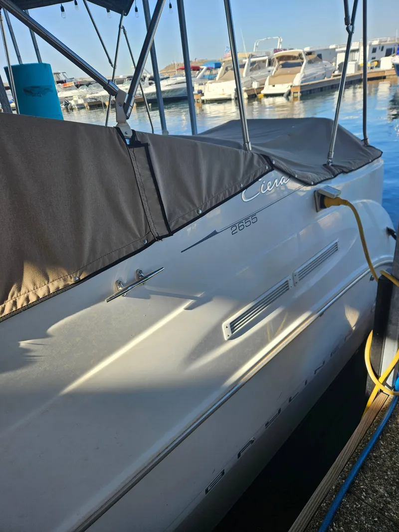 Slide: The Image of 2002 Bayliner 2655 Ciera boat docked at marina, covered and ready for use. - 4