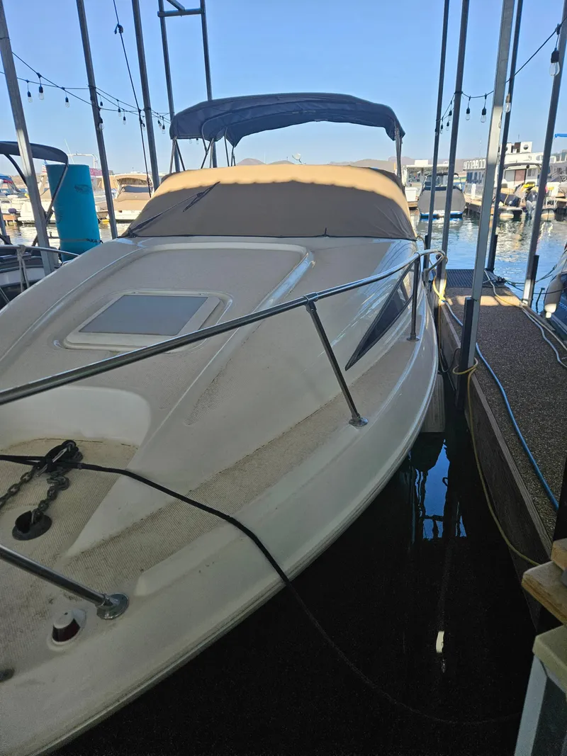 Slide: The Image of 2002 Bayliner 2655 Ciera boat docked in marina under clear blue sky. - 5