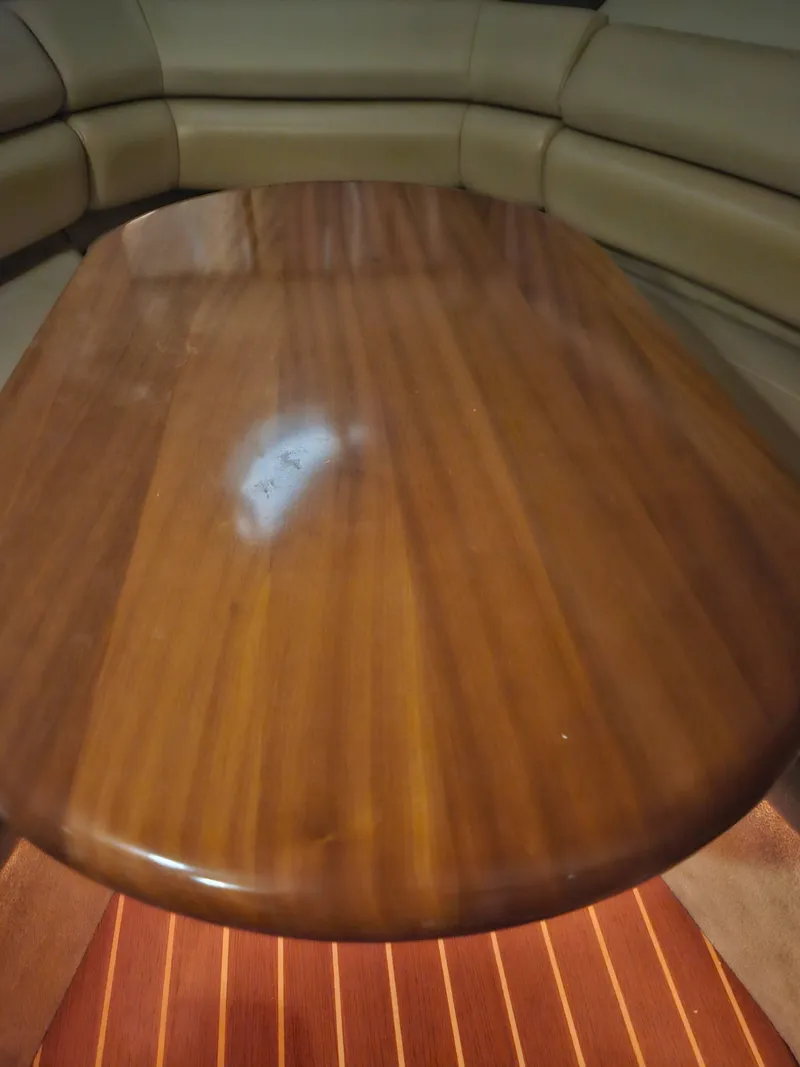 Slide: The Image of Wooden table in the cabin of a 2009 Monterey 260SCR boat. - 12