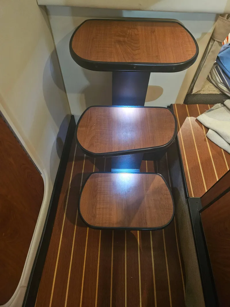 Slide: The Image of Wooden steps with lighting in a 2009 Monterey 260SCR boat interior. - 18