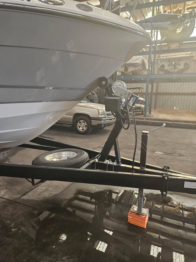 Slide: The Image of 2009 Monterey 260SCR boat on trailer in storage facility. - 5