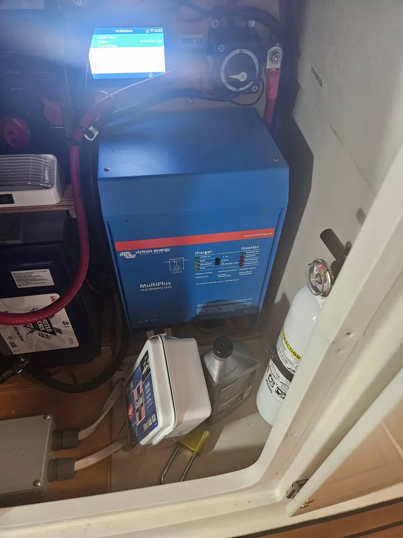 Slide: The Image of 2009 Monterey 260SCR engine compartment with Victron Energy MultiPlus inverter and fire extinguisher. - 7